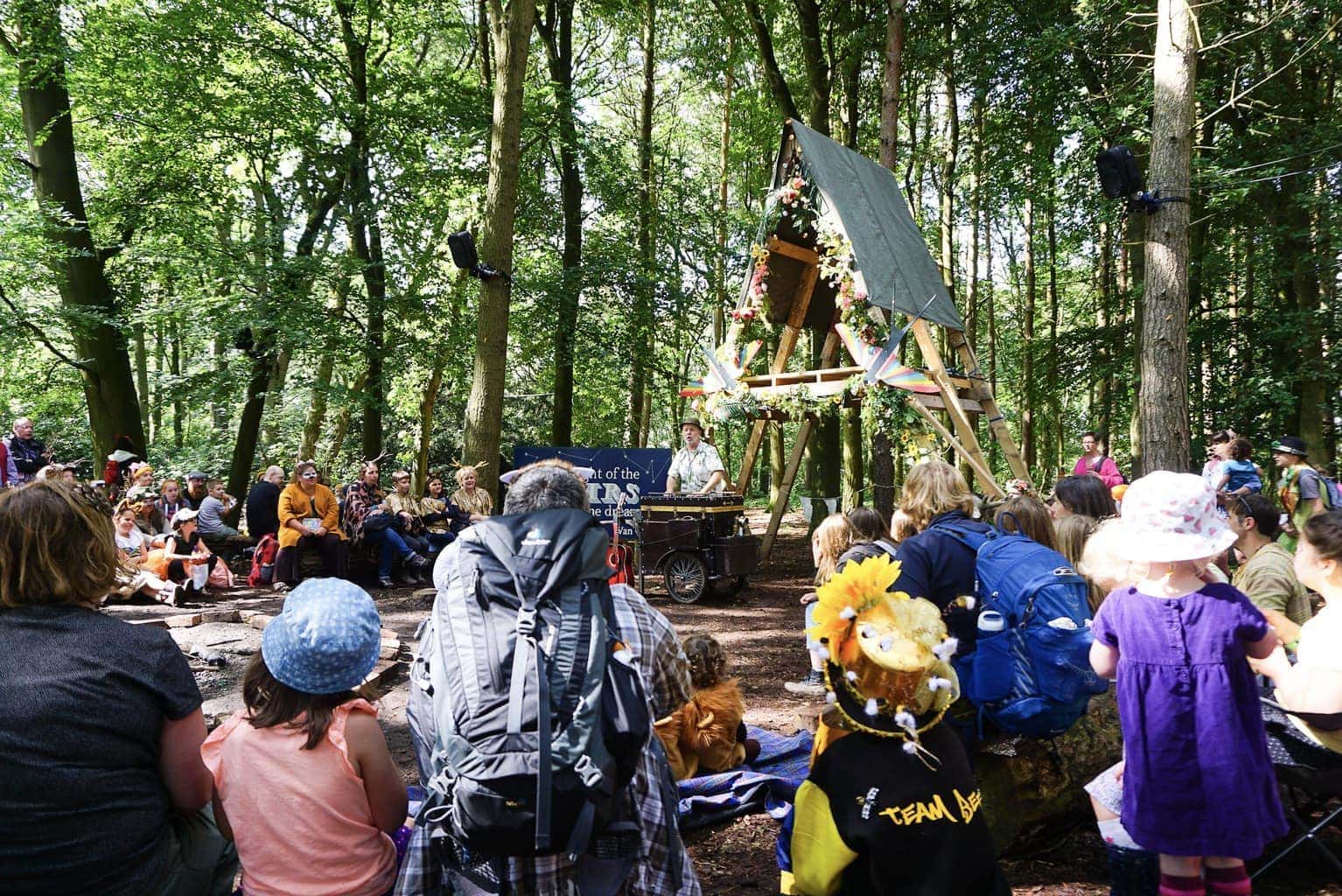 Just So Festival Day Tickets – the perfect introduction to a family festival! MT Just So Festival 1 While we camped at Just So Festival back in 2017 and had a great time, this year we decided to return for a day. The Saturday to be precise. We’re lucky enough to live under an hour’s drive from the festival location, Rode Hall in Cheshire, and with us heading off on holiday on the Monday morning, we thought we’d completely immerse ourselves in everything Just So from dawn (9am ish) until dusk (8pm ish) and then head home to sleep and get sorted. If you were following the festival antics on social media, you might know that almost a month’s worth of rain fell on the opening Friday afternoon which unfortunately meant long queues to get in to the grounds and a whole lot of mud. By the time we arrived on the Saturday morning, there was a lot of slip-sliding and the decision was made to close the car park to any additional cars later that afternoon and for the whole of Sunday. Obviously, disappointing for those who couldn’t get to the festival by other means of transport but the festival organisers were quick to communicate the change in circumstances and offer refunds. I don’t know what else they could have done. MT Just So Festival 2 How did our day at Just So Festival go? I can’t lie, the mud was a pain. We ventured down to the main stage area, Footlights, where we’d normally spend an hour or two listening to the bands playing, but with no seats and no mud-free ground for a picnic blanket, we lasted five minutes. The Ministry of Games area, a previous favourite with my boys (aged 8 and six), was in a similar state. They found squelching through the mud fun for the first few metres but they got annoyed because their wellies kept slipping off and they couldn’t move around as quickly as they would have liked. But, now the negatives are out of the way, I have a whole load of positives for you. Despite not being able to tick off everything on our list, we experienced a day jam-packed with entertainment, humour and laughter. And a lot of ice cream. SO much ice cream! MT Just So Festival 3 We started our day by meeting with the tribal leaders (we’re a family made up of two foxes and two stags) who were so funny and really got the boys excited for the day ahead. Picking a tribe - be that owls, foxes, fish, stags, frogs, lions or bees -  is a really nice part of the Just So experience. You can wear a full costume with face paints, a pair of ears, a t-shirt with your chosen animal, or just wear your own clothes if dressing up is not for you. You can get involved in the tribal tournament and attempt to win golden pebbles for your chosen team as much or as little as you want. It’s fun to keep checking the scoreboard to see who is in the lead as you pass by, especially if you have a divided family and can tease each other. MT Just So Festival 4 One of the joys of Just So is stumbling across the unexpected. You spy so many amazing things as you amble around the grounds. Campfire songs and stories, awe-inspiring marble runs, singing classes, a real actual bath being pedalled round with a family bathing in it (yes, really) and also, quieter spots to take a minute or two to regroup and consult your programme. MT Just So Festival 5 
My personal recommendation would be to make a note of a handful of ‘must-sees’ but then to take a walk and see what you come across. Even if you have something pencilled in, if you and your children are having fun, don't be in a rush to move on to the next thing unless it’s something unmissable like James Campbell or The Fabularium. James had my children crying with laughter and The Fabularium had them completely and utterly spellbound. MT Just So Festival 6 How did Just So Festival day tickets compare to camping for the entire weekend? Well, it had its pluses and minuses. The kids gave it their all for one day. We packed in show after show, and explored every corner of the (muddy) site. They had ice cream-covered faces and tired legs when we left and I don’t think a second day could have lived up to the first. But they did miss popping back to the tent for a rest stop now and again. MT Just So Festival 7 As I mentioned, most of the grounds were so muddy that we couldn’t use a picnic blanket (some places were better later in the afternoon when the sun came out) and there didn’t seem to be many chairs around so we were on our feet a lot. And because we weren’t camping and hadn’t brought our own food and drink with us, we spent a small fortune on meals and snacks. MT Just So Festival 8 All in all, we had an amazing time and as we’re not natural campers, I think we’ll continue popping to the festival as day ticket holders. If you’re on the fence about heading to a family festival with your children, a day ticket is a great way of testing the water. Just So is a festival that makes it incredibly easy for families to spend quality time together and take part in so many amazing and unusual things. It's really special. 

If you’re tempted to visit Just So Festival in 2020, keep an eye on the website as early bird tickets tend to be released at a slightly cheaper price. Even if it rains, I promise you, you'll leave with incredibly happy children and feeling somewhat nostalgic for your own childhood. MT Just So Festival 9
