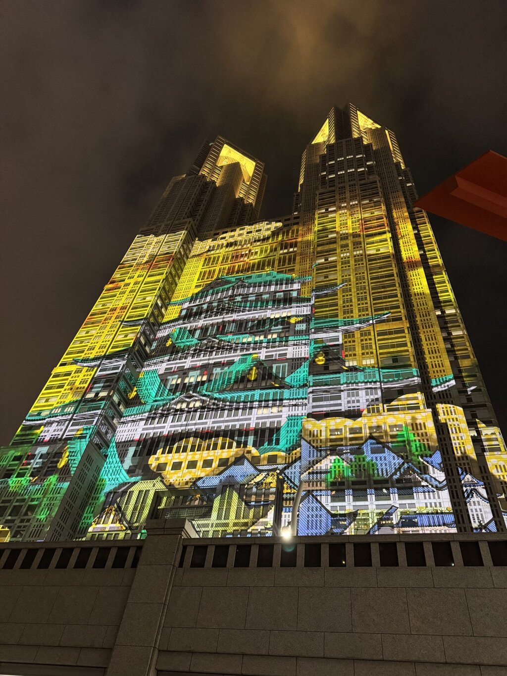 The Tokyo Metropolitan Government Building in Shinjuku hosts "TOKYO Night & Light," a free, nightly projection mapping show certified as the world's largest permanent display. Running every 30 minutes (typically 6:00 PM–9:30 PM, varies by season), it features digital art, Japanese themes, and popular content like Pokémon or Godzilla.