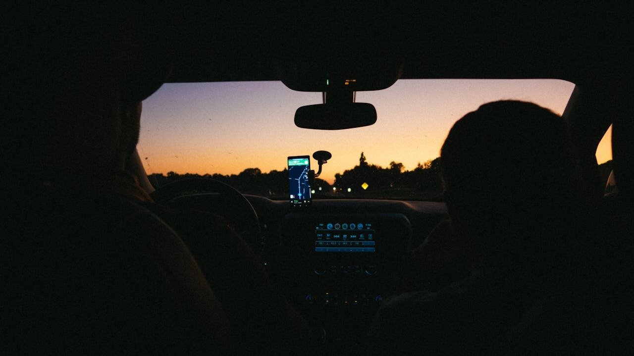 A couple navigating the road during their trip in a well-chosen car