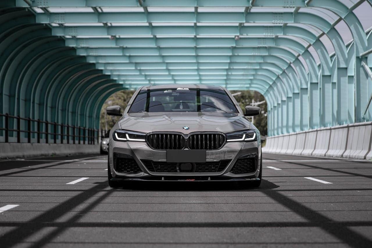 Charcoal grey BMW 5 Series on the road