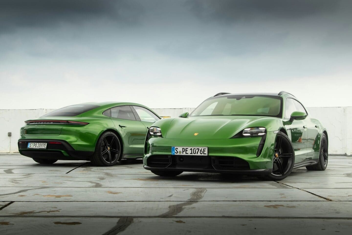 Green Porsche Taycans parked on an airstrip, ready for their next adventure