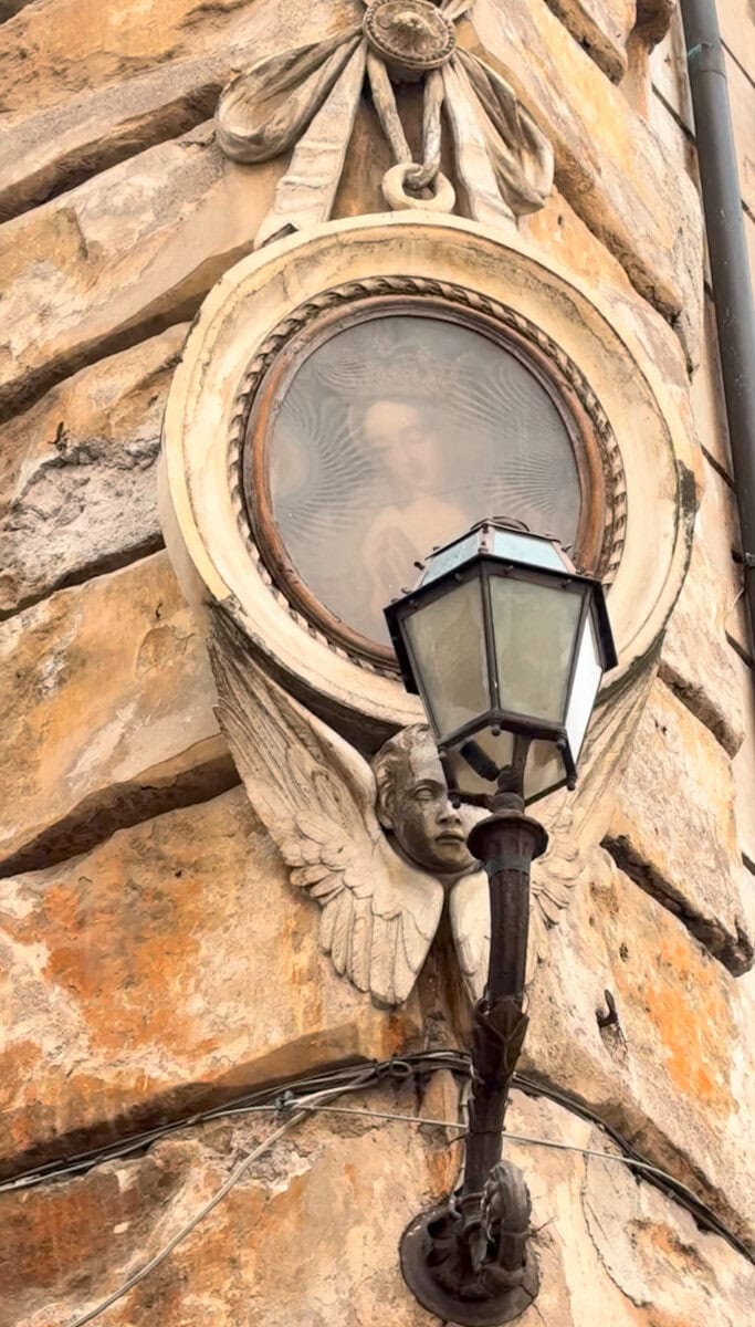 Shrine to the Vigin Mary over a light in Rome